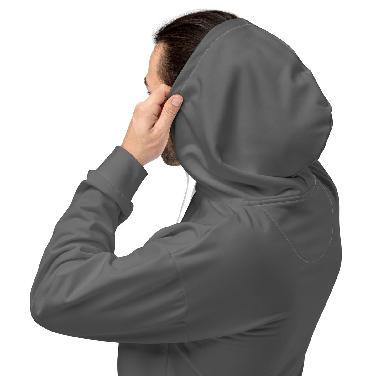 Model adjusting the hood of the grey True Form premium relaxed fit motion performance hoodie, shown from the side.
