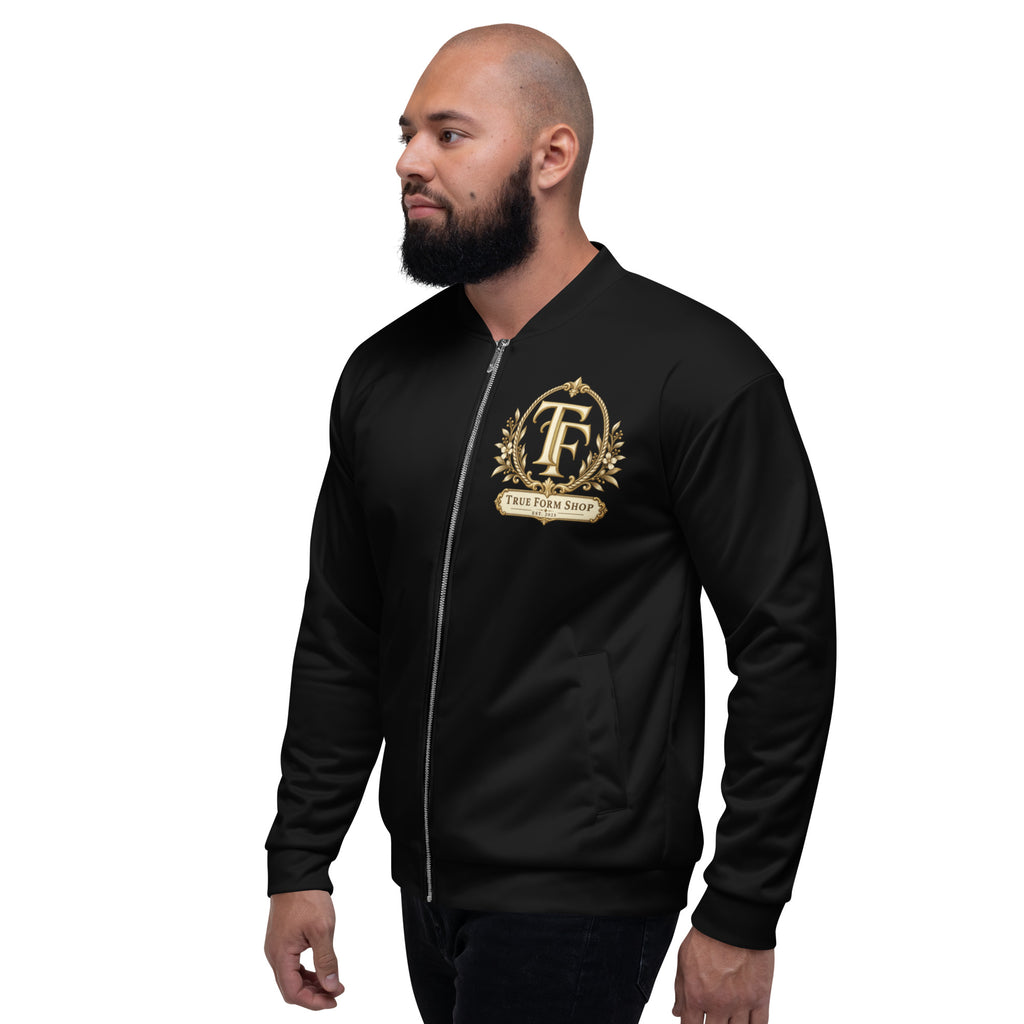 Black True Form Basketball Jacket Elite Performance Edition with a gold ornate True Form TF emblem and True Form Shop banner, shown worn from the front at an angle.