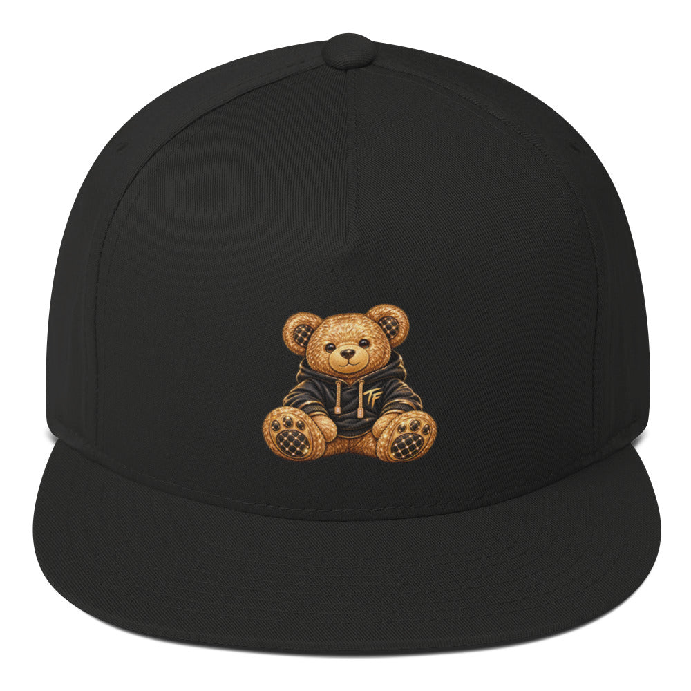 Black TF Premium flat bill cap with a teddy bear graphic, shown from the front.