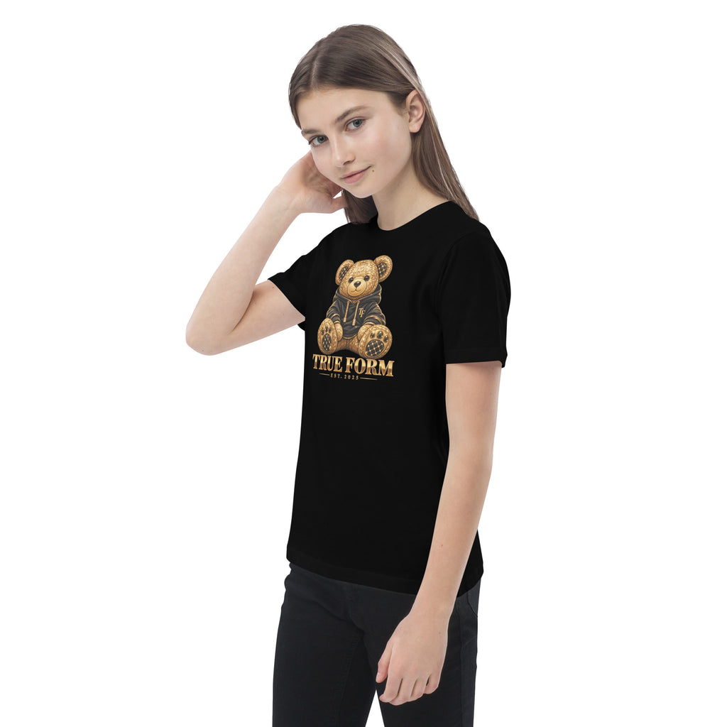 Black Motion Tee by True Form with a teddy bear graphic and True Form text, shown worn from the front at an angle.