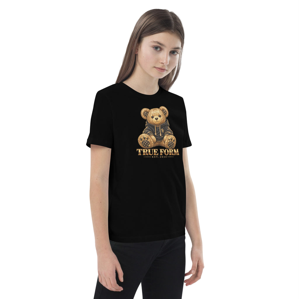 Black Motion Tee by True Form with a teddy bear graphic and True Form text, shown worn from the front at an angle.