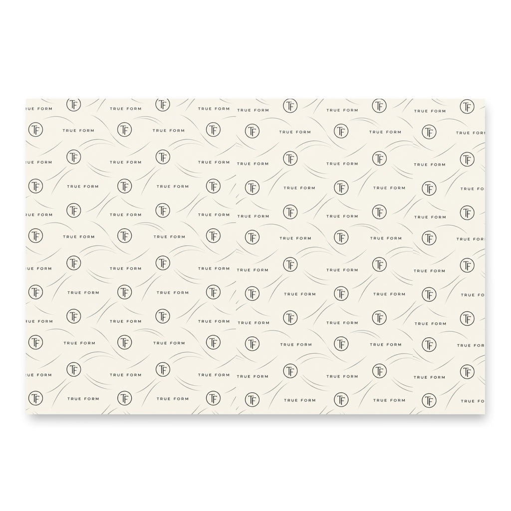 White True Form premium holiday tree wrapping paper with a repeating black TF logo and True Form lettering pattern.